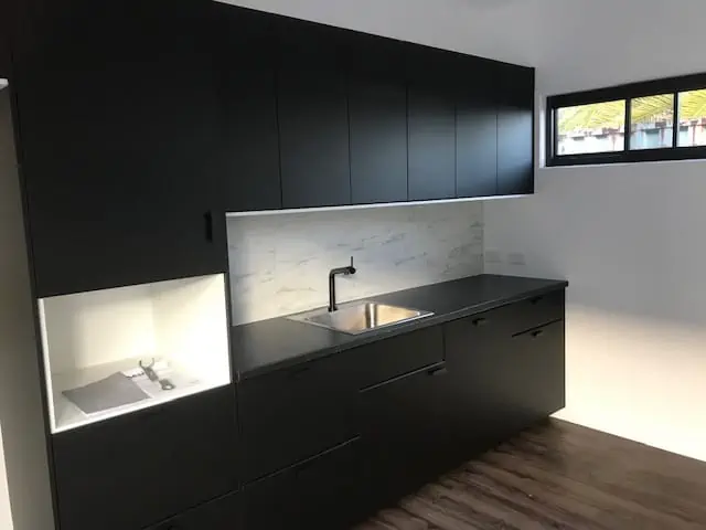 A sleek modern kitchen in a modular building