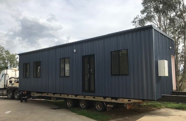 A modern one bedroom granny flat with dark cladding