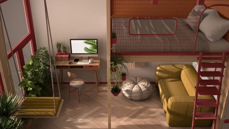 Minimalist studio apartment in a modular building with a loft bunk double bed, a yellow sofa and desk area below.
