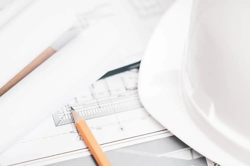 Helmet, tools and drawings for construction