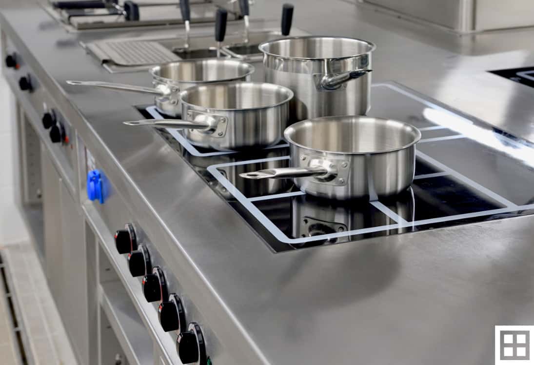 Commercial kitchen with pans on the stove